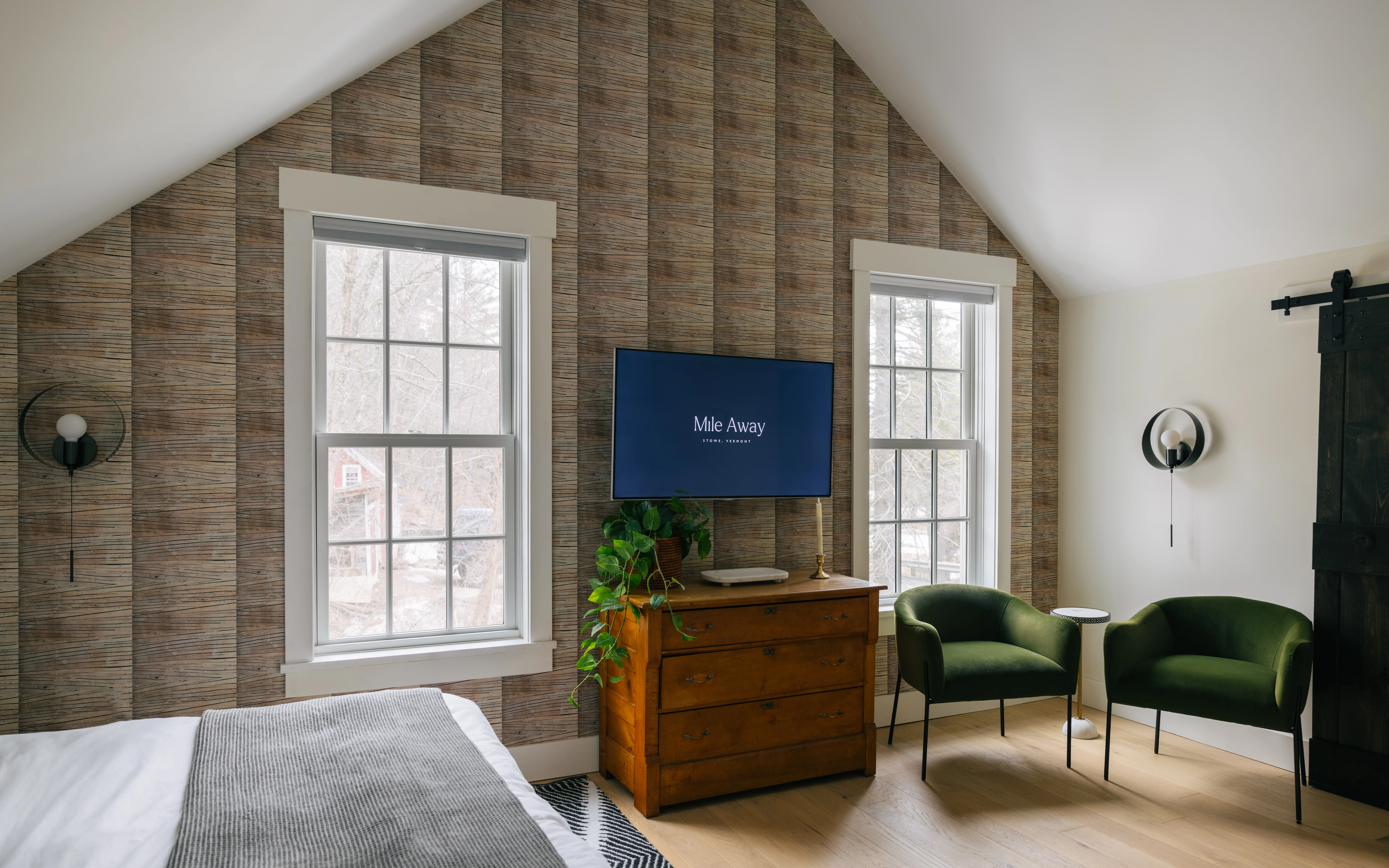 Upstairs king bedroom first angle with natural light and refined neutral tones
